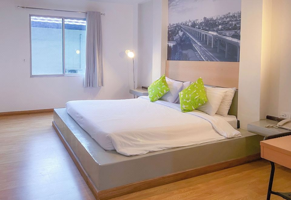 Standard room with neat modern furnishings, flat-screen TV and en-suite bathroom