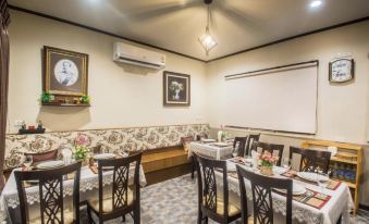 Guest room at Cana Boutique Hotel Bangkok — smart TV, bathrobes, slippers and full amenities