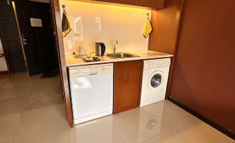 Clean, air-conditioned room interior at Cattreya Place, Bang Sue Bangkok
