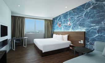 Superior room at Centara Life Government Complex Chaeng Watthana — clean, modern interior with LCD TV and work desk