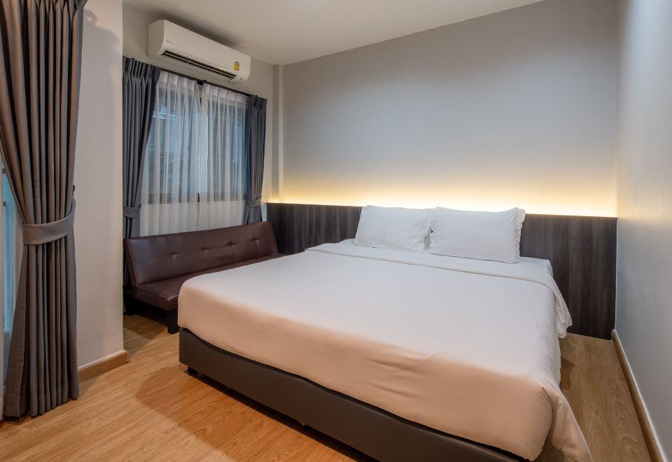 Apartment-style room at College Haus Rangnam with kitchenette and full-size fridge