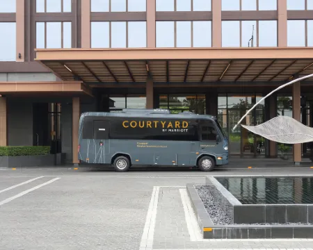Outdoor pool and garden area at Courtyard Marriott Suvarnabhumi, Bangkok