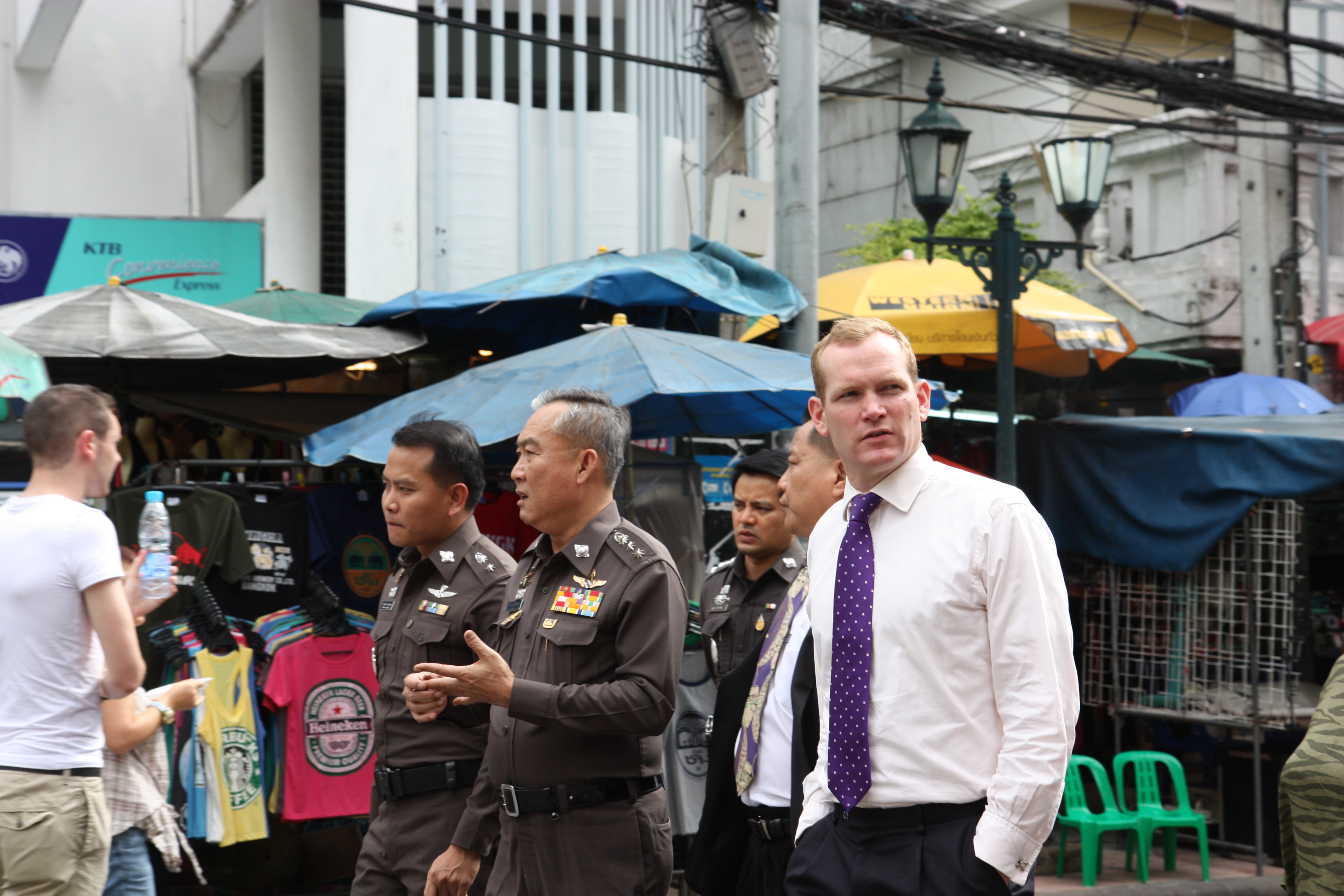 Street-level view of Khaosan Road Bangkok showing the vibrant mix of travellers, vendors and open-air restaurants