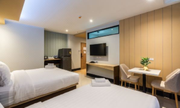 Lobby and communal area at Hi Sotel Victory Monument, clean modern design in a bright, uncluttered layout