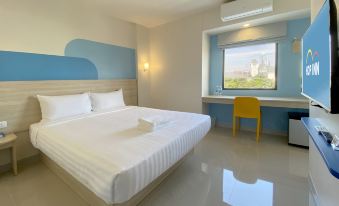 The en-suite bathroom with water heater and shower at Hop Inn Bangkok Bangna