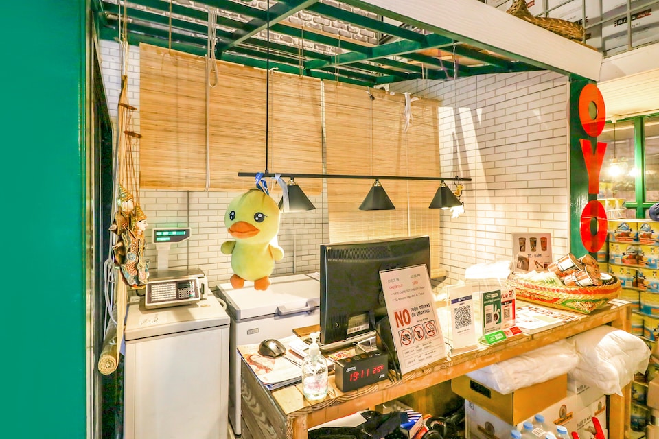 Common area of a budget hostel in Charoen Krung, Bangkok — relaxed and functional