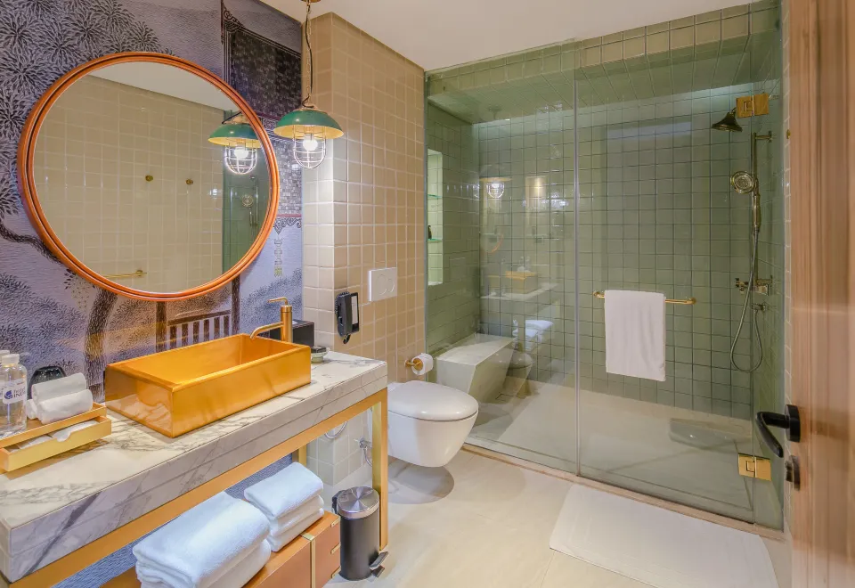 Boutique guest room with private balcony and city views, Hotel Indigo Bangkok