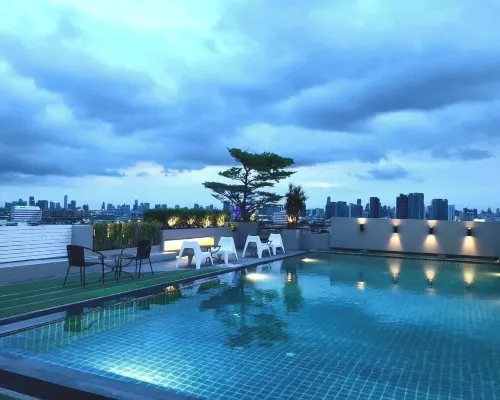 Rooftop bar view at Bangkok Inter Place, with Rajamangala National Stadium visible within 300 metres
