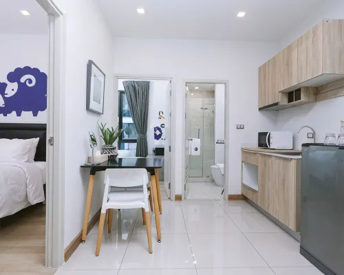 Koko Couple room at Kokotel Bangkok Sukhumvit 50 — King bed, clean modern styling with good natural light