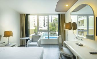 Deluxe room at Le Tada Parkview Hotel — tiled floors, king bed, clean and spacious