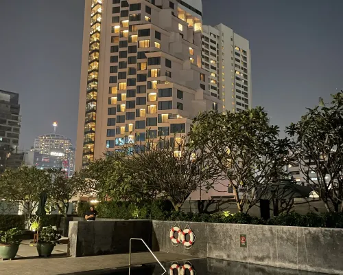 Spacious modern room at Maitria Hotel Sukhumvit 18 Bangkok with King bed in warm contemporary tones