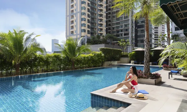 Outdoor pool at Marriott Executive Apartments Sukhumvit Park Bangkok with surrounding sunbathing area