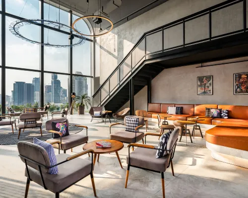 Sato San Rooftop Bar on floor 32 of Moxy Bangkok Ratchaprasong with Bangkok skyline views