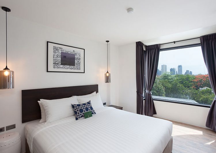 Superior Double room at Oriental Heritage Residence — monochrome Thai-Chinese design with a large work desk