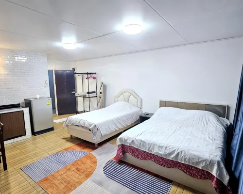 Living area and bedroom in a condo-style room close to IMPACT Muang Thong Thani