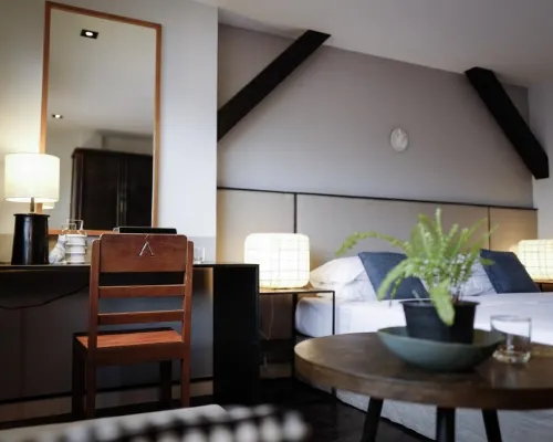 Grand Deluxe room at P&R Residence Hotel Bang Rak Bangkok — clean double bed, air-con, flat-screen TV
