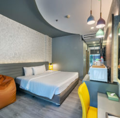 Deluxe room interior at Qiu Hotel Sukhumvit — 30 sqm contemporary design