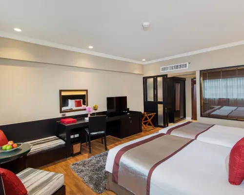 Deluxe River View room at Ramada Plaza Bangkok overlooking the Chao Phraya River