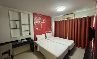 Entrance and lobby area of Sarasinee All Suite Boutique Hotel on Charoen Nakorn Road, Khlong San