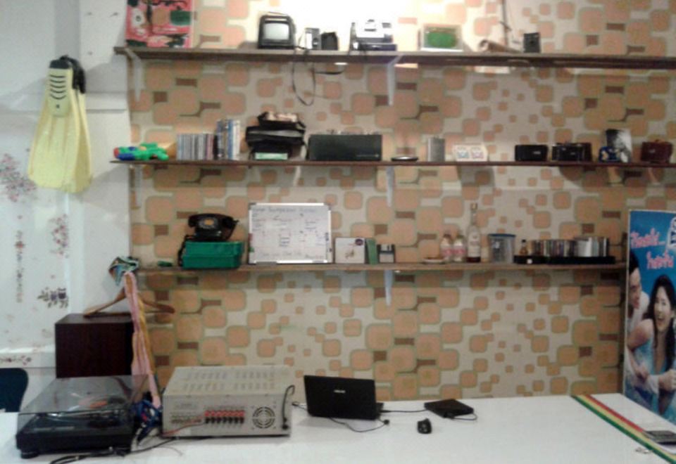 Shared lounge and bar area at Hatyai Backpackers Hostel Hat Yai