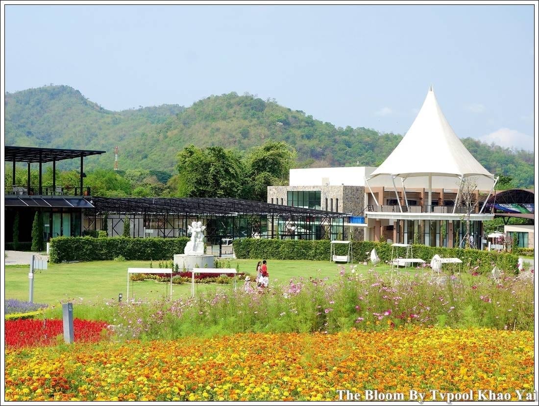 A photo spot in The Bloom by TV Pool flower garden, decorated with flower beds and props