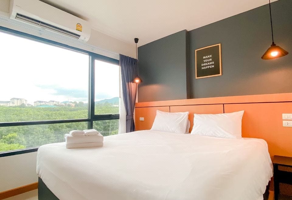 The buildings and garden at Nornchill Khaoyai in Pak Chong, Khao Yai, with parking right outside the rooms