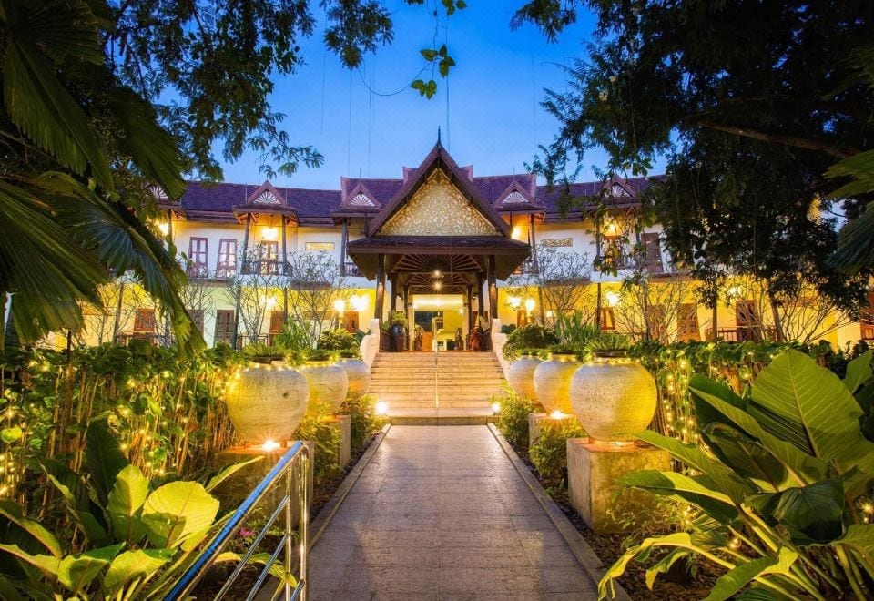 The buildings and leafy garden grounds of Phuwanalee Resort Khao Yai on Thanarat Road, Mu Si