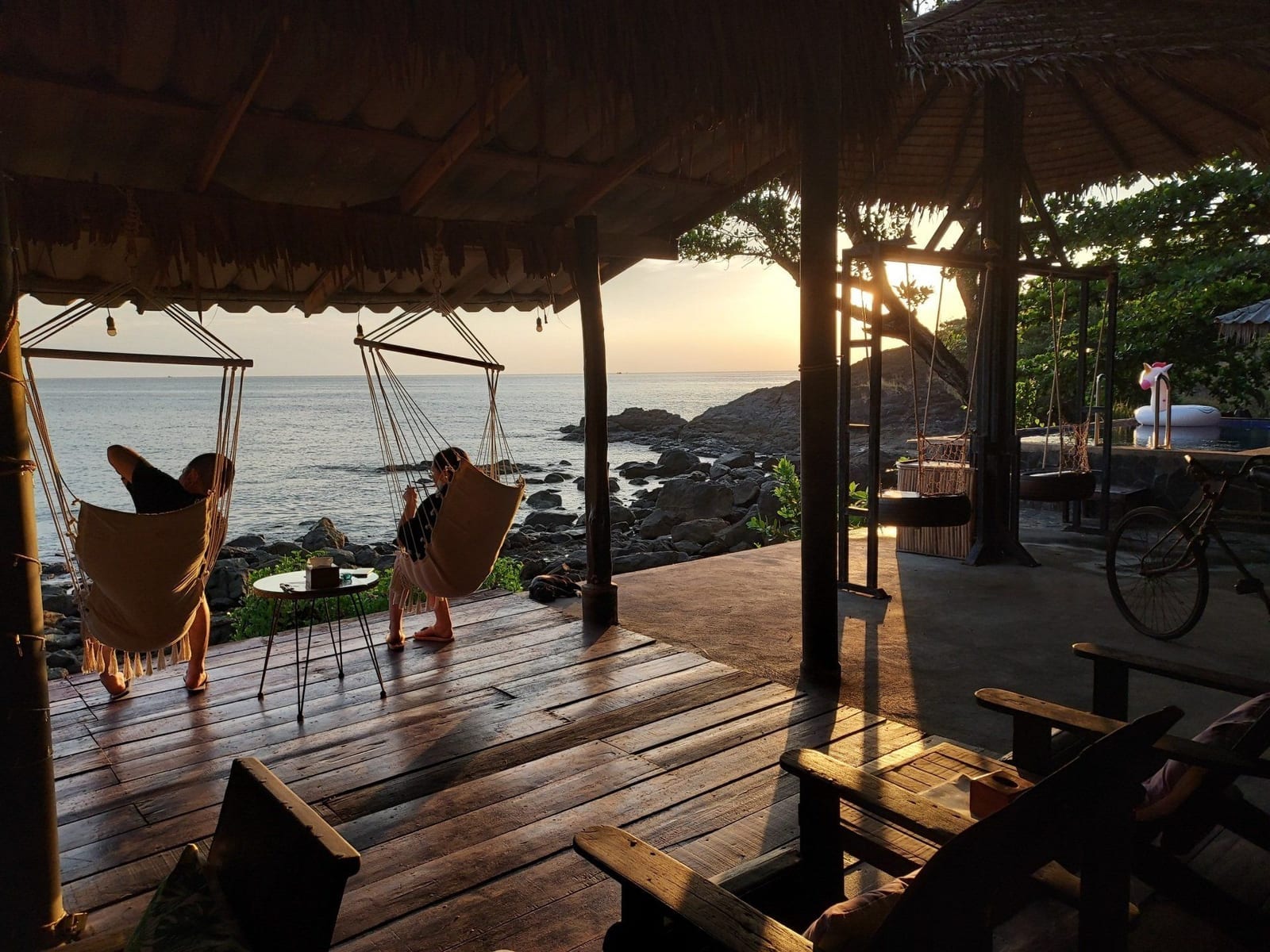 The clifftop restaurant at Cliff Cottage at sunset over the sea at Bang Bao