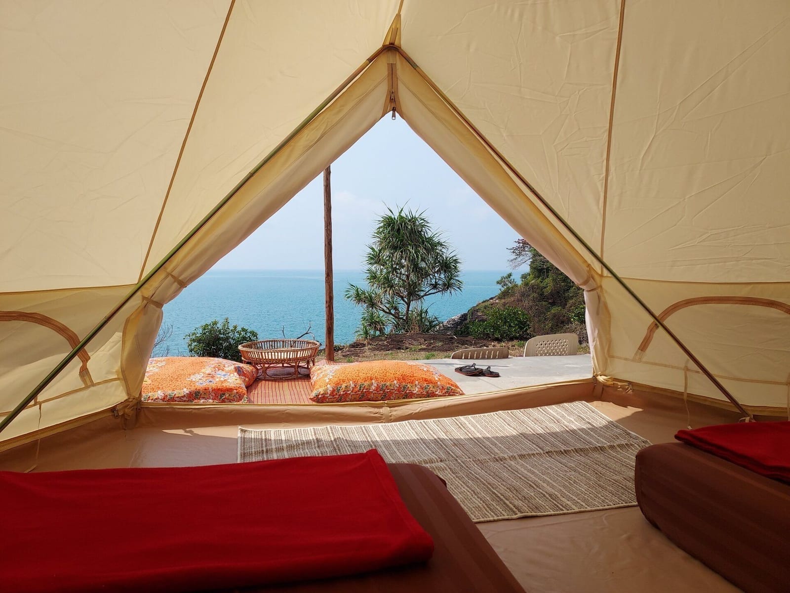 A clifftop glamping tent at Cliff Cottage Koh Chang looking out over the sea and the sunset