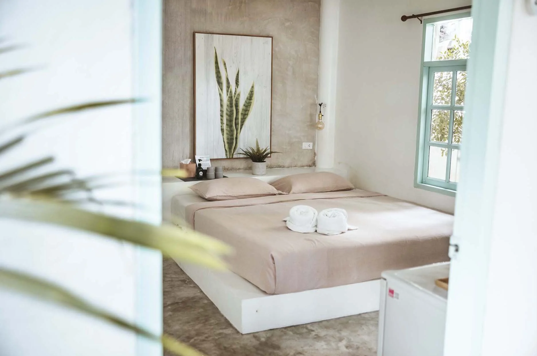 Clean minimalist bungalow interior at Indie Beach Bungalows with AC and a hot shower