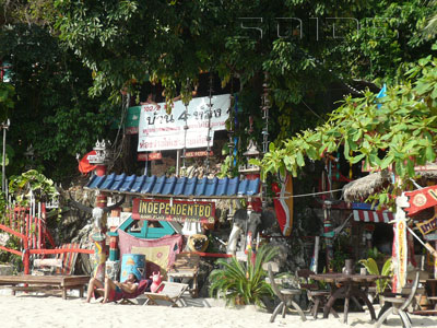 Bohemian wooden bungalows staggered up the forested hillside among the trees