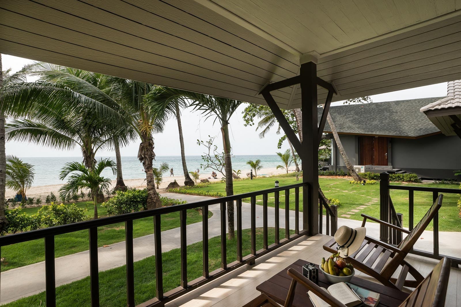 Seaside room in warm tones with a private balcony facing the garden