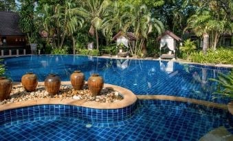 Low-rise bungalows and villas in the wide gardens of Ramayana Koh Chang Resort & Spa