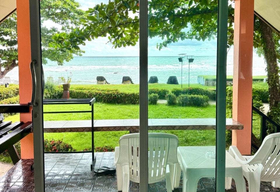 A beachfront bungalow at Sea Flower Resort with a balcony looking out over the sea on the west side of Koh Chang