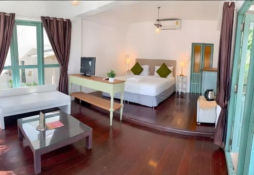 Chic wooden bungalows of Warapura Resort on the rocky shore at Lonely Beach, Koh Chang
