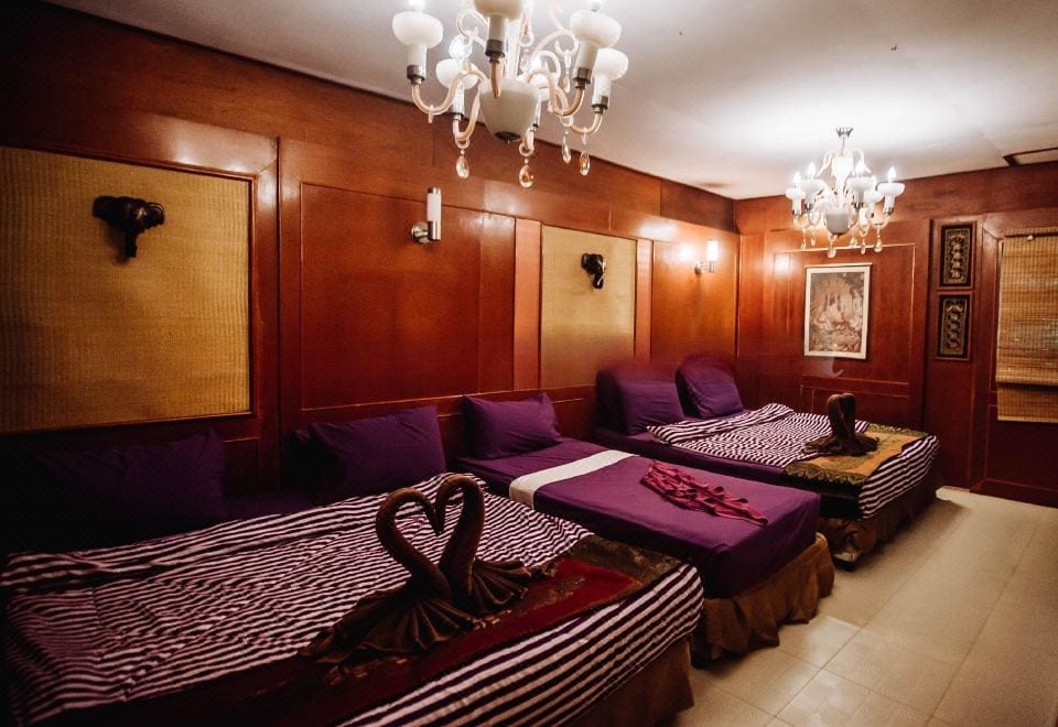 Thai-style massage room decorated with wood and patterned fabric inside White Sand Beach Resort, Koh Chang
