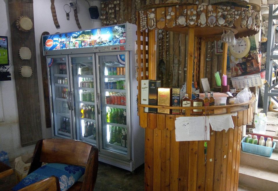 Simple A/C guest room at Baan Sai Thong, Koh Larn, with a bed and flat-screen TV