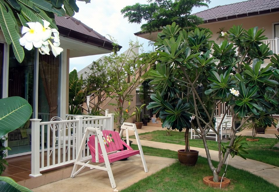 Bright, spacious room at Sea Beach Koh Larn 1 with a large bed and open floor space