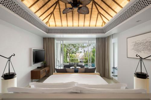 An Ocean Pool Suite at Banyan Tree Krabi with a high pitched timber-slat ceiling opening onto a terrace and private pool