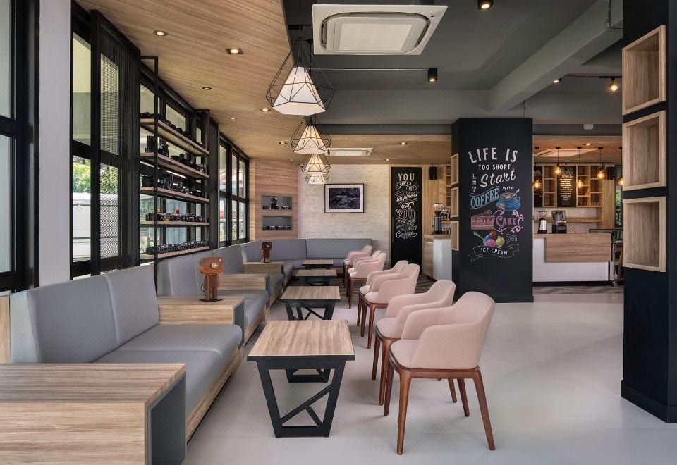 มุมตกแต่งภายใน R Photo Hotel นครพนม ดีไซน์ธีมกล้องถ่ายรูปพร้อมกล้องวินเทจ