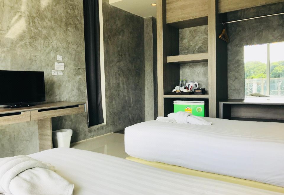 ห้องพักของ The Peak Boutique Hotel เตียงใหญ่ ผ้าปูสะอาด ห้องกว้าง