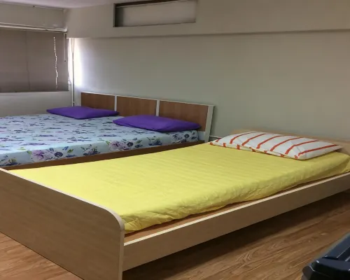 Room interior at IMPACT Challenger Muang Thong Thani Serviced Apartment with bed and kitchenette area