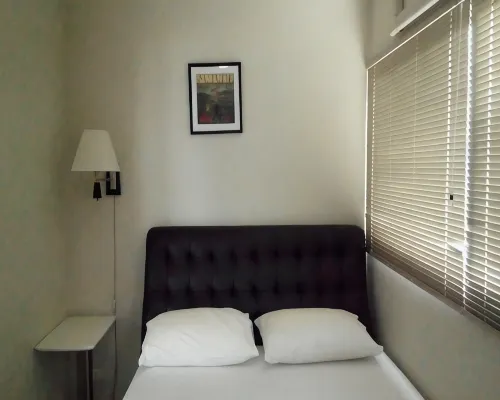 Living area and kitchen zone inside IMPACT Challenger Serviced Apartment, Pak Kret, Nonthaburi