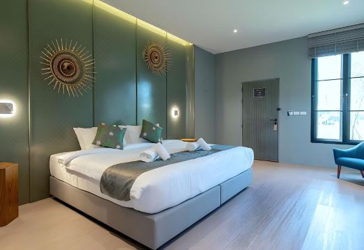 ห้องพักของ Pattanipirom Boutique Hotel ตกแต่งสไตล์ลอฟต์ โทนสีอบอุ่น