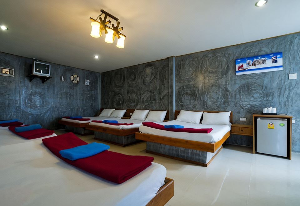ห้องพักของ Lampam Resort พัทลุง เตียงกว้าง สะอาด มีระเบียงส่วนตัว