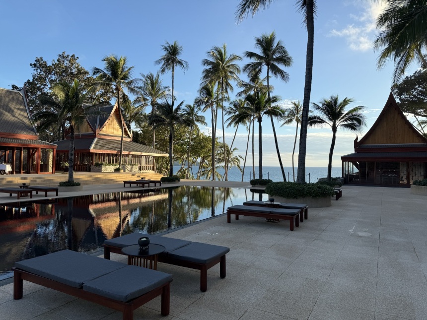 Main pool terrace at Amanpuri surrounded by coconut palms beside the Andaman Sea