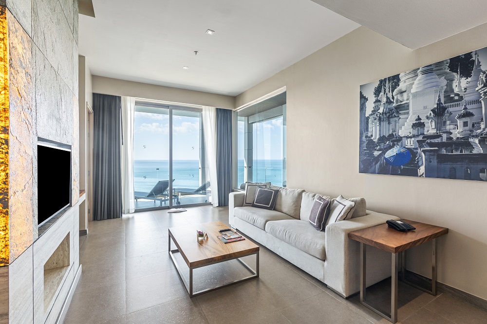 The living room of a Sea View Executive Pool Penthouse with floor-to-ceiling sea-view windows