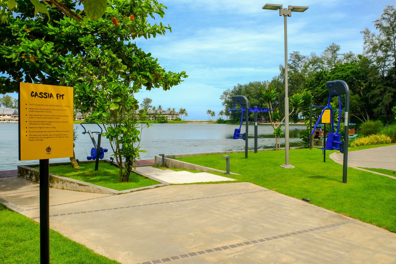 Cassia FIT outdoor exercise stations along the lagoon at Cassia Phuket looking towards Bang Tao Beach