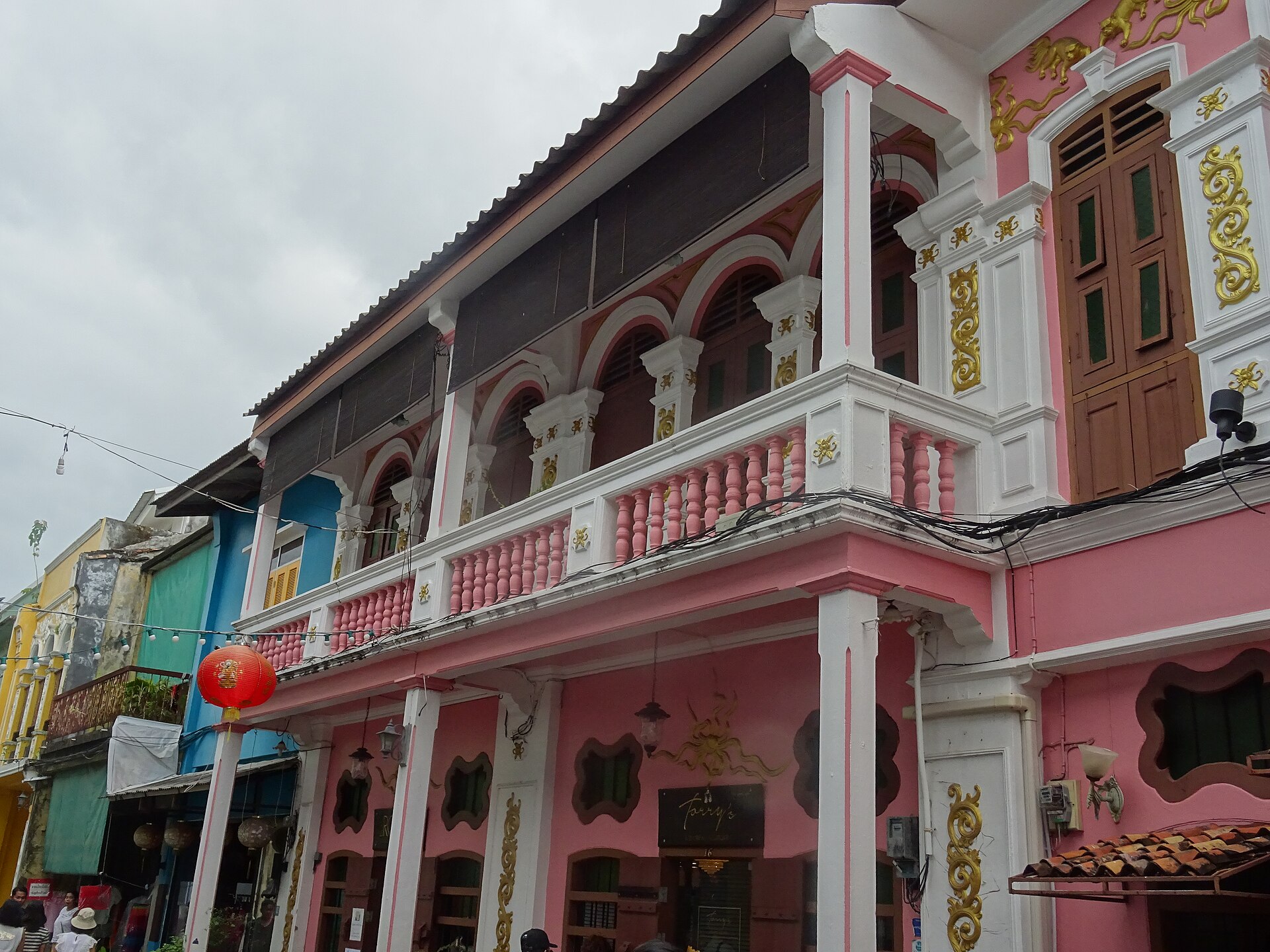 Pastel-painted Sino-Portuguese shophouses lining Soi Rommanee in Old Phuket Town, home to The Rommanee Boutique Guesthouse