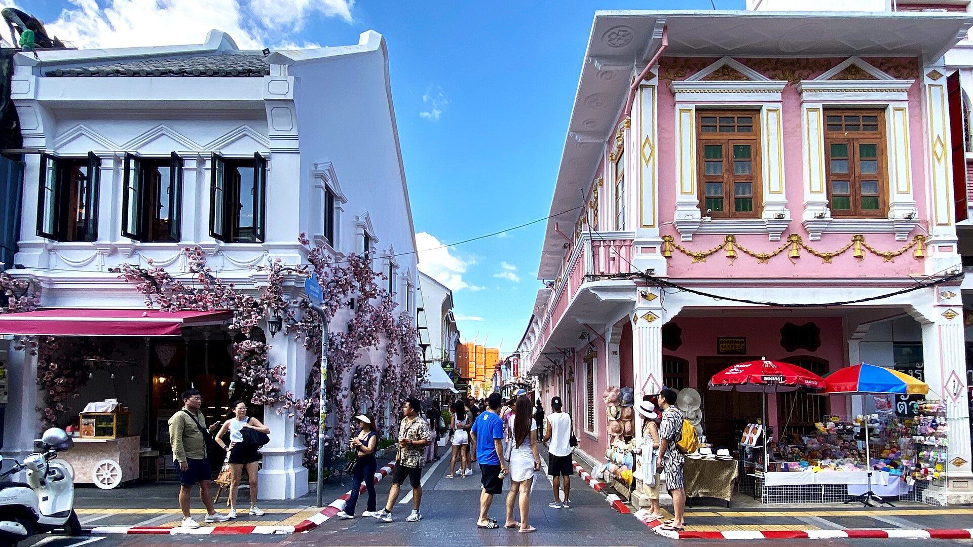 The southern end of Soi Rommanee where it meets Thalang Road, with rows of colourful old shophouses in Old Phuket Town
